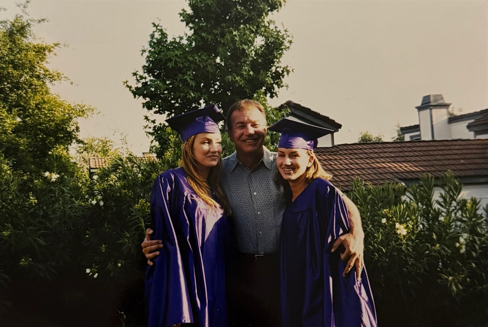 Robert with two graduates